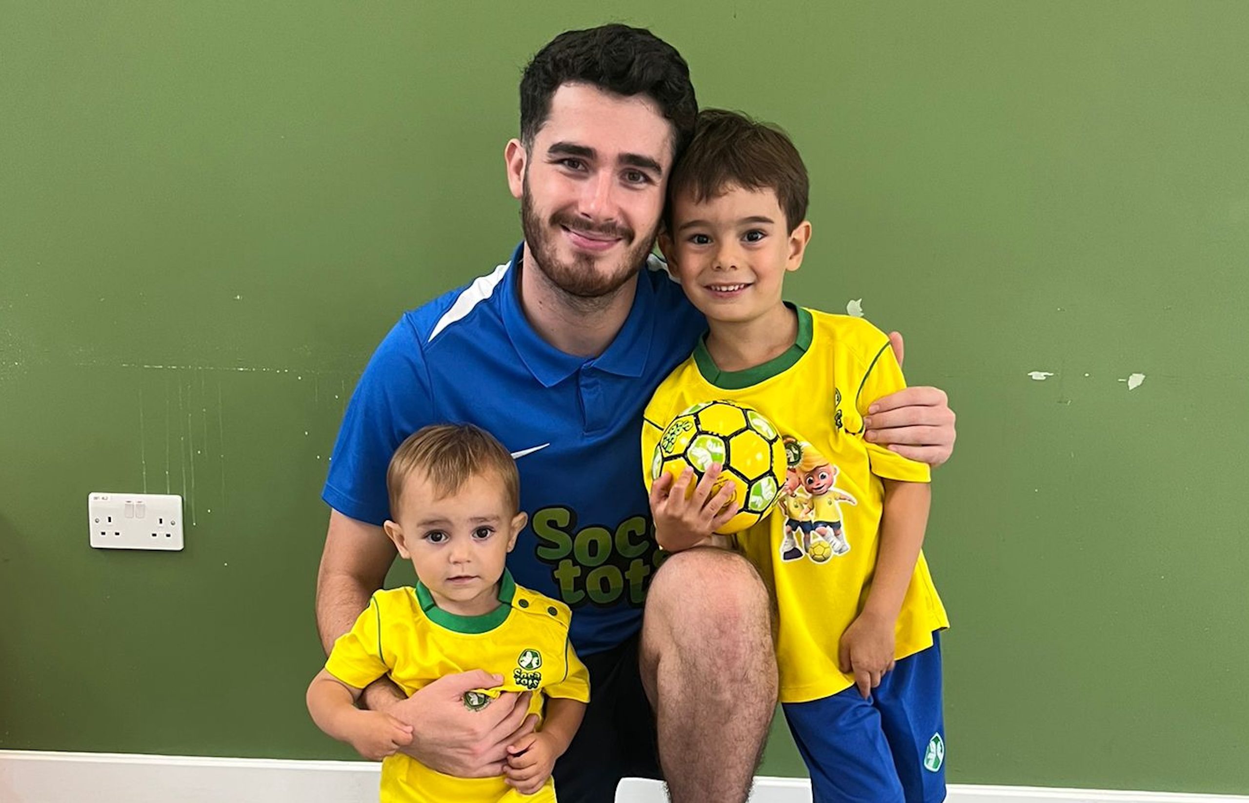 Image shows Socatots coach with two Socatots students.
